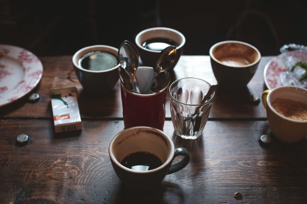 Coffee cups on wooden café table