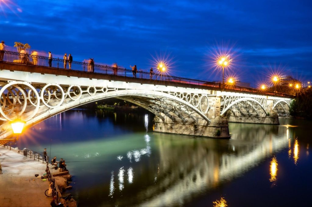 Triana Bridge over Guadalquivir at night
