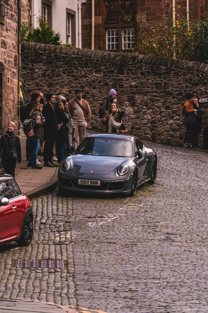 Tour group gathered on cobbled Edinburgh street
