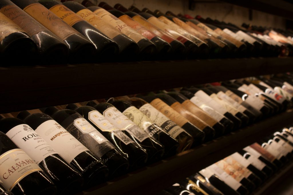 Rows of wine bottles in a cellar