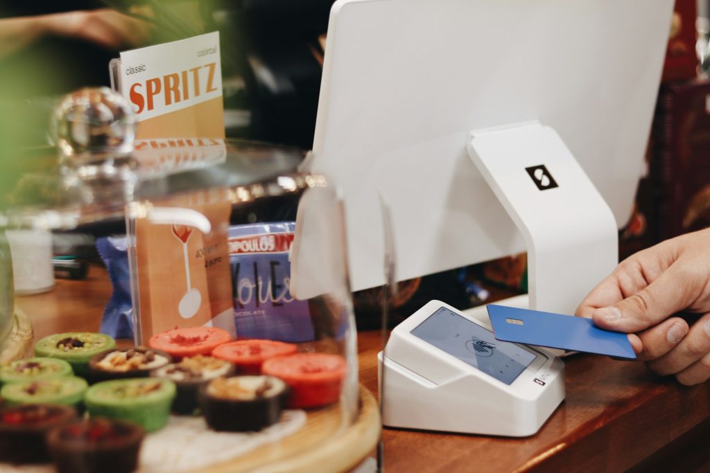 Customer paying by card at café terminal