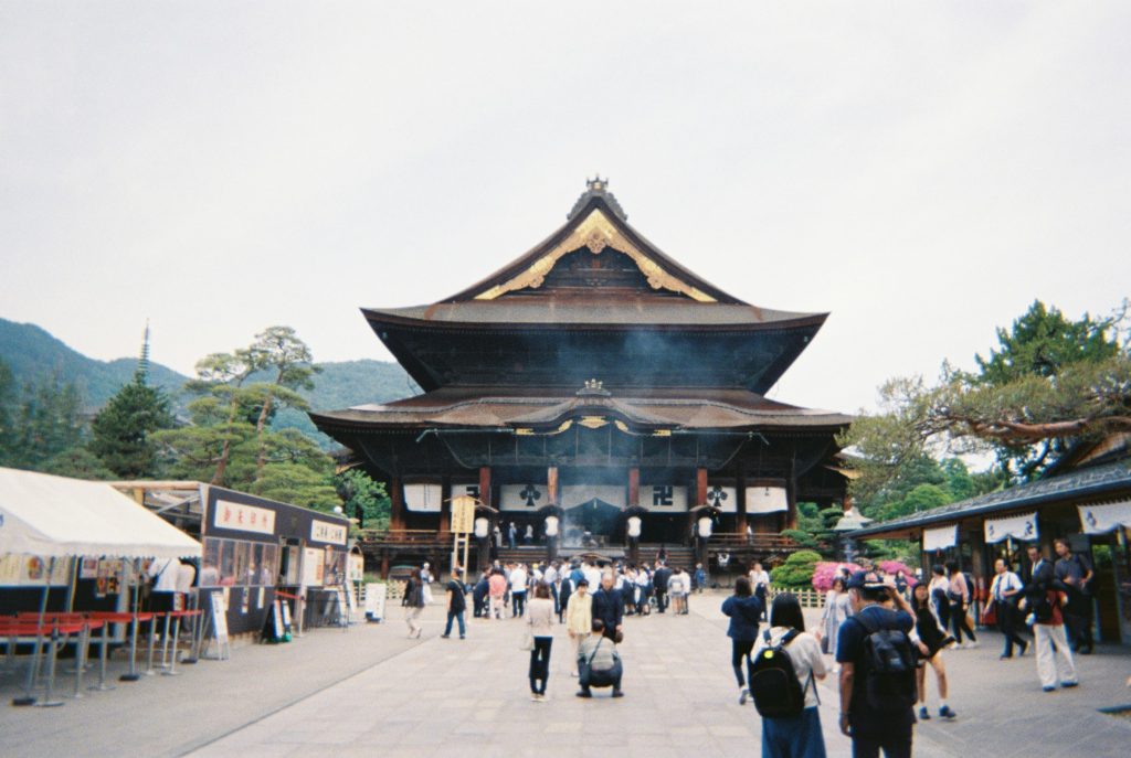 Visitors at Zenko-ji Temple main hall in Japan